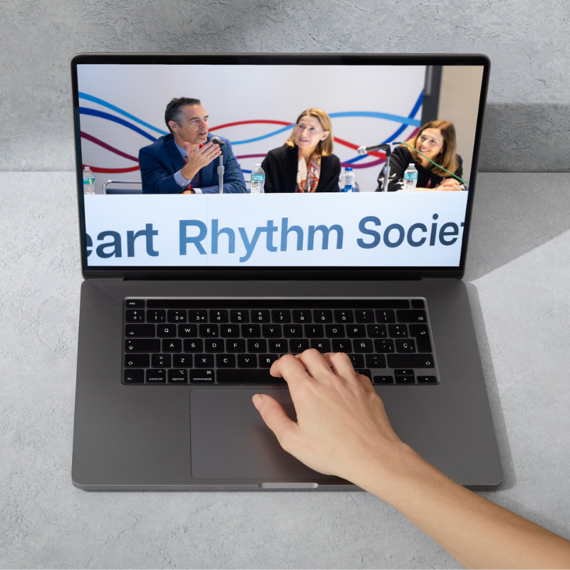 Three panelists seated at a Heart Rhythm Society conference table, displayed on a laptop screen