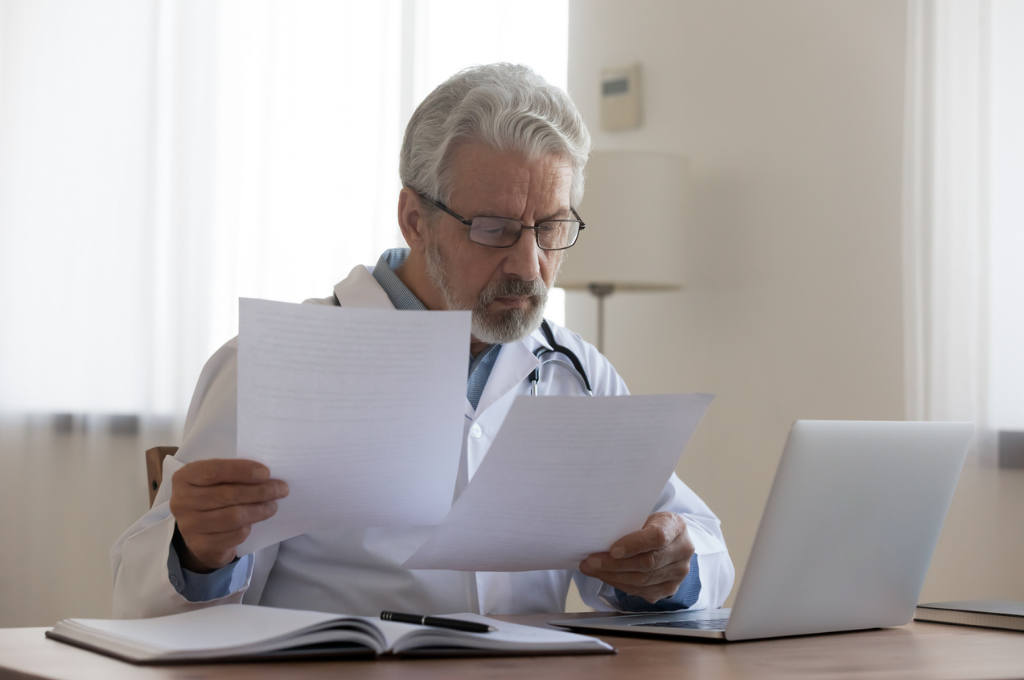 Doctor reading scientific papers